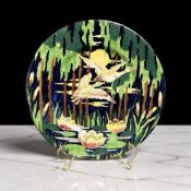 A Maling lustre cabinet plate depicting geese in flight, diameter 29 cm.