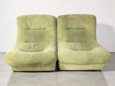 A pair of mid-century lounge chairs, in pale green upholstery, width 88 cm.