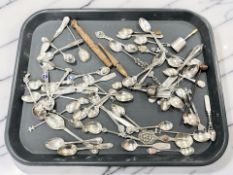 A collection of silver and silver-plate teaspoons and other cutlery,