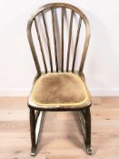 A spindle back rocking chair.