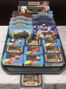 Twenty one boxed die cast delivery vans and haulage vehicles including Matchbox and Lledo.