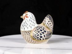 A Royal Crown Derby Chicken paperweight, with gold stopper and original box.