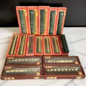 A collection of boxed Hornby and Airfix OO gauge rolling stock including various passenger cars,