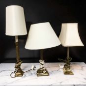 Three brass table lamps with shades, tallest 58 cm.