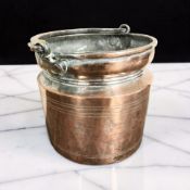 A 19th century copper plate on pewter swing handled bucket, height 28 cm including handle.