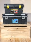 A pine box and two plastic toolboxes.