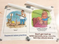 A group of unframed Herman posters.