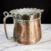 A copper plate on pewter vessel with handle, height 19 cm.
