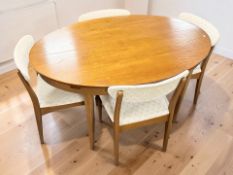 A Grieves & Thomas teak oval extending dining table with internal leaf,