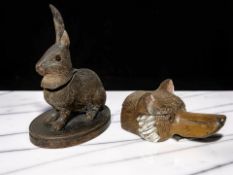 Two Black Forest carved wooden ink wells in the form of a rabbit and a bear, rabbit 16 cm high.