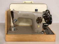 A Singer 201K sewing machine.