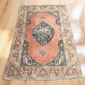 An antique Kirman rug, South-East Iran, circa 1900, 203 cm x 143 cm.