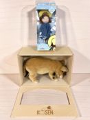 A Madeline doll in box and Kosen pig in box.