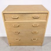 A mid-century oak veneered and teak four drawer chest, width 77 cm.