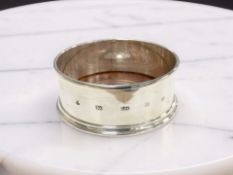 An Elizabeth II silver bottle coaster, M C Hersey & Son Ltd, London 2001, diameter 11cm.