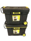 Two Stanley mobile tool chests containing various hardware.