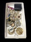 A small tray of costume jewellery, watch pendant, brooches, Chinese coins, etc.