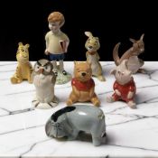 A group of Beswick Winnie the Pooh figures, tallest 13 cm.
