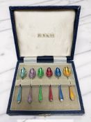 A set of six enameled coffee spoons in case, apparently unmarked.