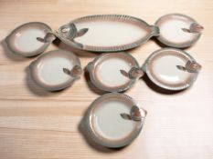 A group of French Digoin & Sarreguemines fish dishes, largest 54 cm wide.