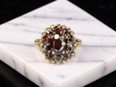 A 9ct gold garnet cluster ring, size N CONDITION REPORT: 3.