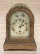 A late Victorian oak Westminster chime mantel clock, height 35 cm.