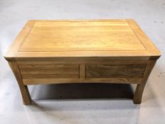 A modern oak two drawer storage coffee table, width 100 cm.