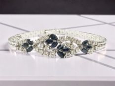 An 18ct white gold diamond and sapphire bracelet, the total diamond weight estimates at 1.