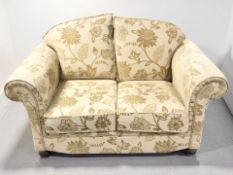 A contemporary two seater settee in gold floral upholstery, width 160 cm.