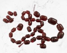 A cherry beaded necklace (Af) CONDITION REPORT: Requries re-stringing.