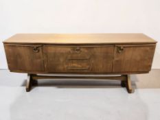 A 20th century Beautility teak bow front low sideboard, 184 cm x 49 cm x 75 cm.