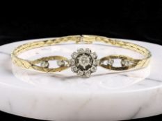 An 18ct gold diamond cluster bracelet, length 17.