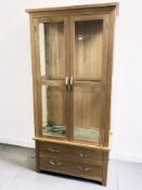 A modern oak display cabinet, 90 cm x 40 cm x 185 cm.