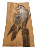 A wooden panel depicting a bird of prey, signed 'N Allan', 69 cm x 38 cm.