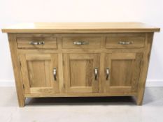A modern oak sideboard, 150 cm x 49 cm x 93 cm.