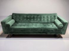 A modern three seater settee in dark green upholstery with bolster cushions, length 212 cm.