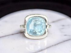 A topaz and diamond ring,