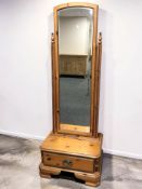 A 20th century pine cheval mirror, width 63 cm.