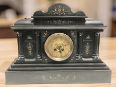 A Victorian black slate mantel clock with pendulum and key, width 49 cm.