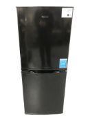 A Candy fridge freezer, width 55 cm.