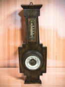 An early 20th century oak barometer, height 52 cm.