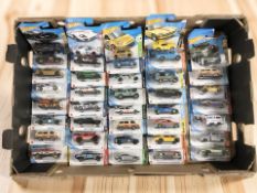 A collection of Hot Wheels die cast cars in boxes.