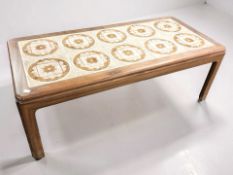 A teak G-Plan rectangular coffee table with tiled top, length 112 cm.
