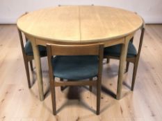 A 20th century teak oval extending dining table, with leaves, overall 170 cm x 123 cm x 76 cm,