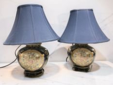 A pair of oriental-style bulbous earthenware table lamps with shades, overall 56 cm high.