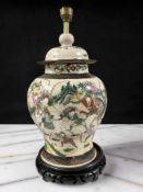 A Chinese crackle glazed earthenware ginger jar converted to a table lamp, on hardwood stand,