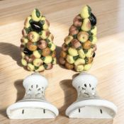 Two large ceramic wall pockets with bunches of fruit,
