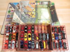 A case containing matchbox die cast cars, race cars, etc.