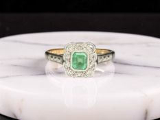 An emerald and diamond cluster ring, stamped 18ct Plat, size M CONDITION REPORT: 2.