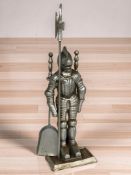 A metal fire companion set in the form of a knight, height 71 cm.